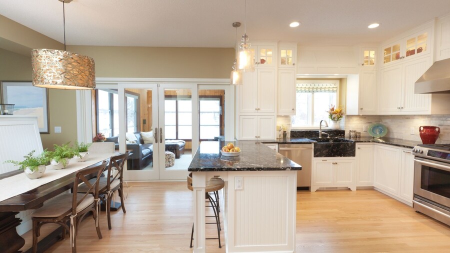 Image of a clean home. Front door open with welcome mat.